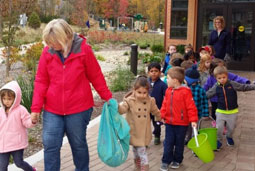 Children play with hand sanitizer bracelets