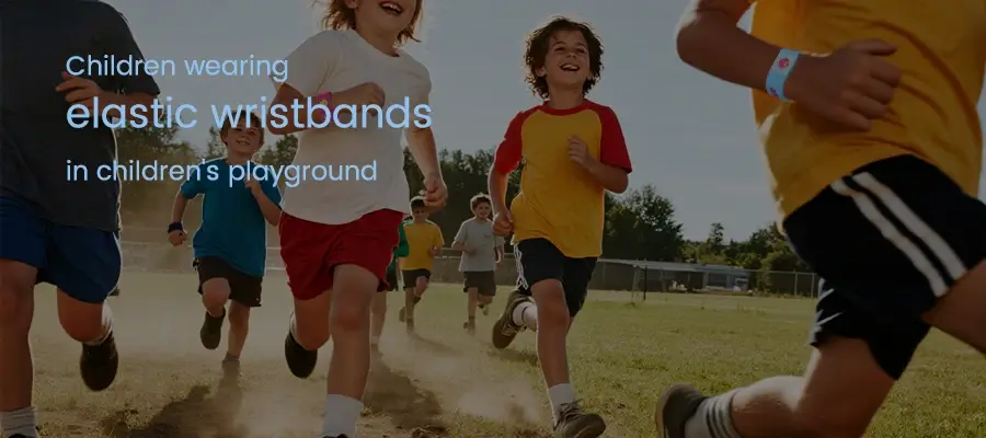 children using elastic wristbands in children's playground